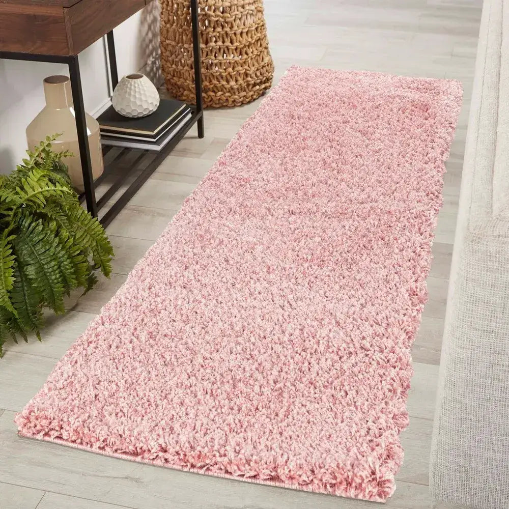 soft baby pink shaggy runner rug in a modern living room