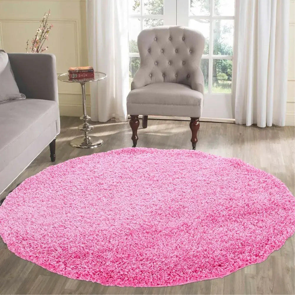 soft pink round shaggy rug in a modern living room