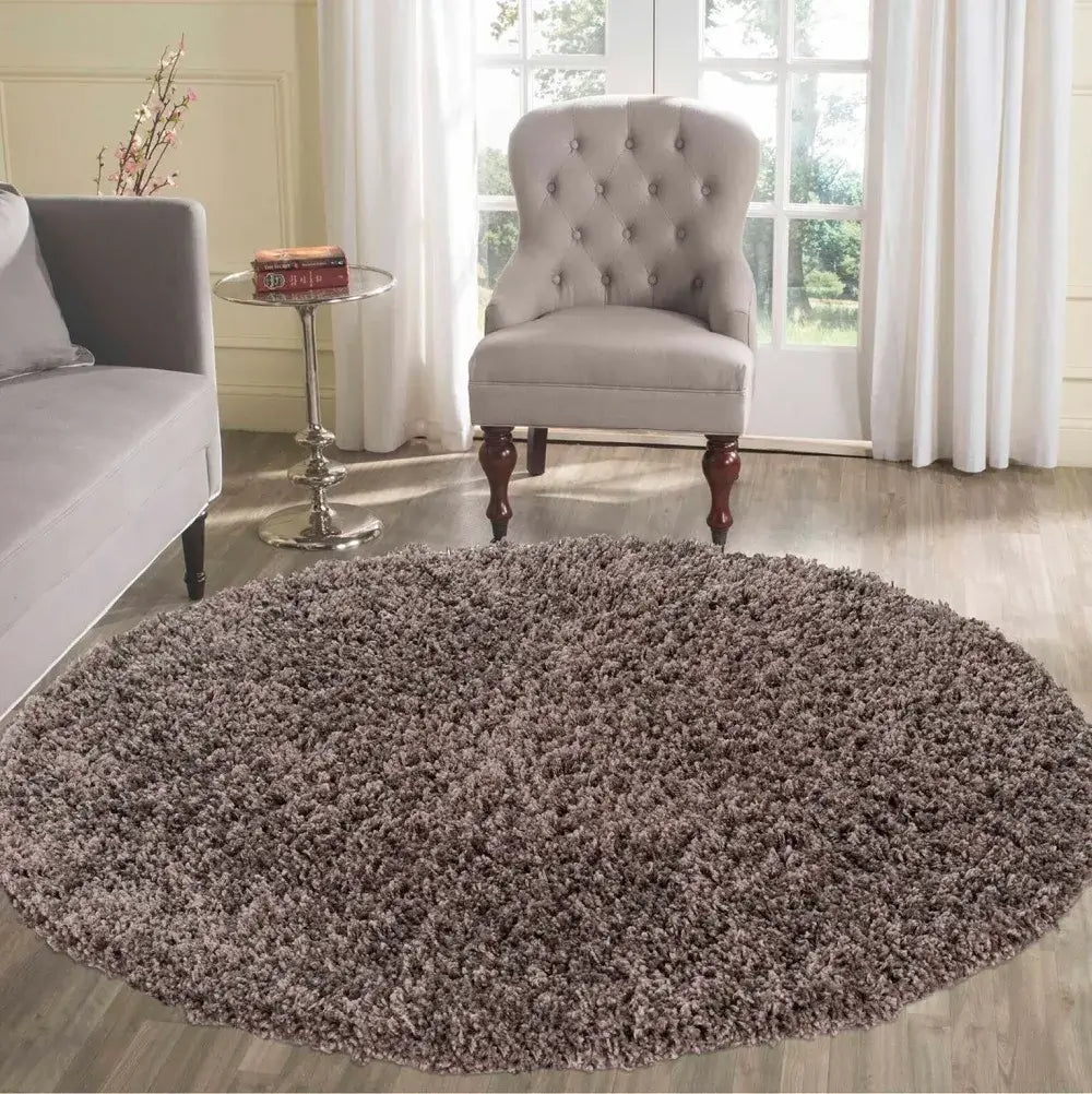 soft taupe round shaggy rug in a modern living room