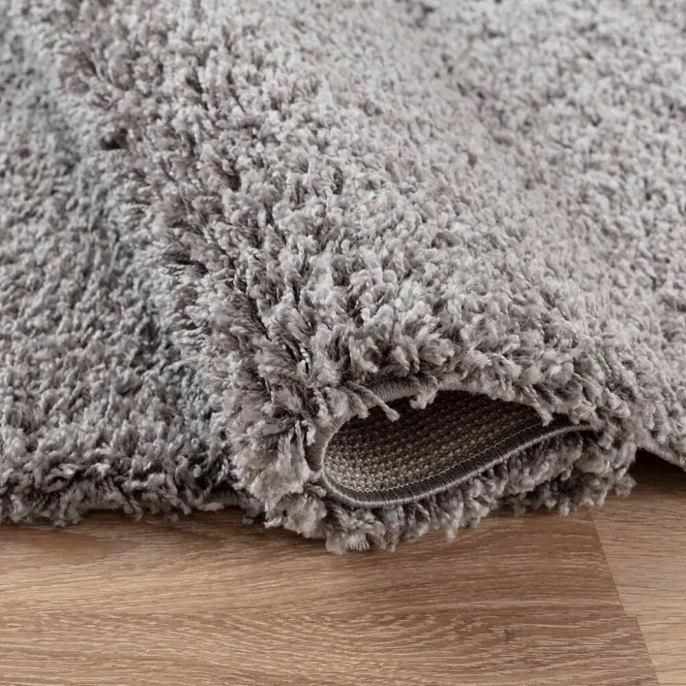 closeup of soft grey shaggy rug in a modern living room