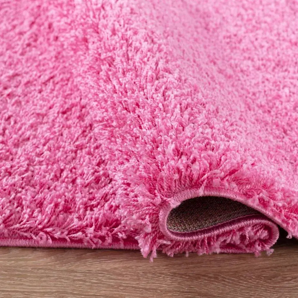 closeup of soft pink shaggy rug in a modern living room